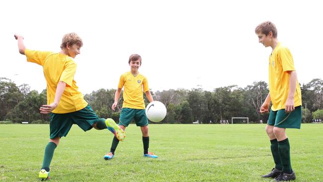 St Augustine Under 13s practising soccer skills at Passmore Reserve, Manly Vale. From left: Thomas West, Sam Raward and Jordan Brewster, all aged 12. Picture: Jess Husband.