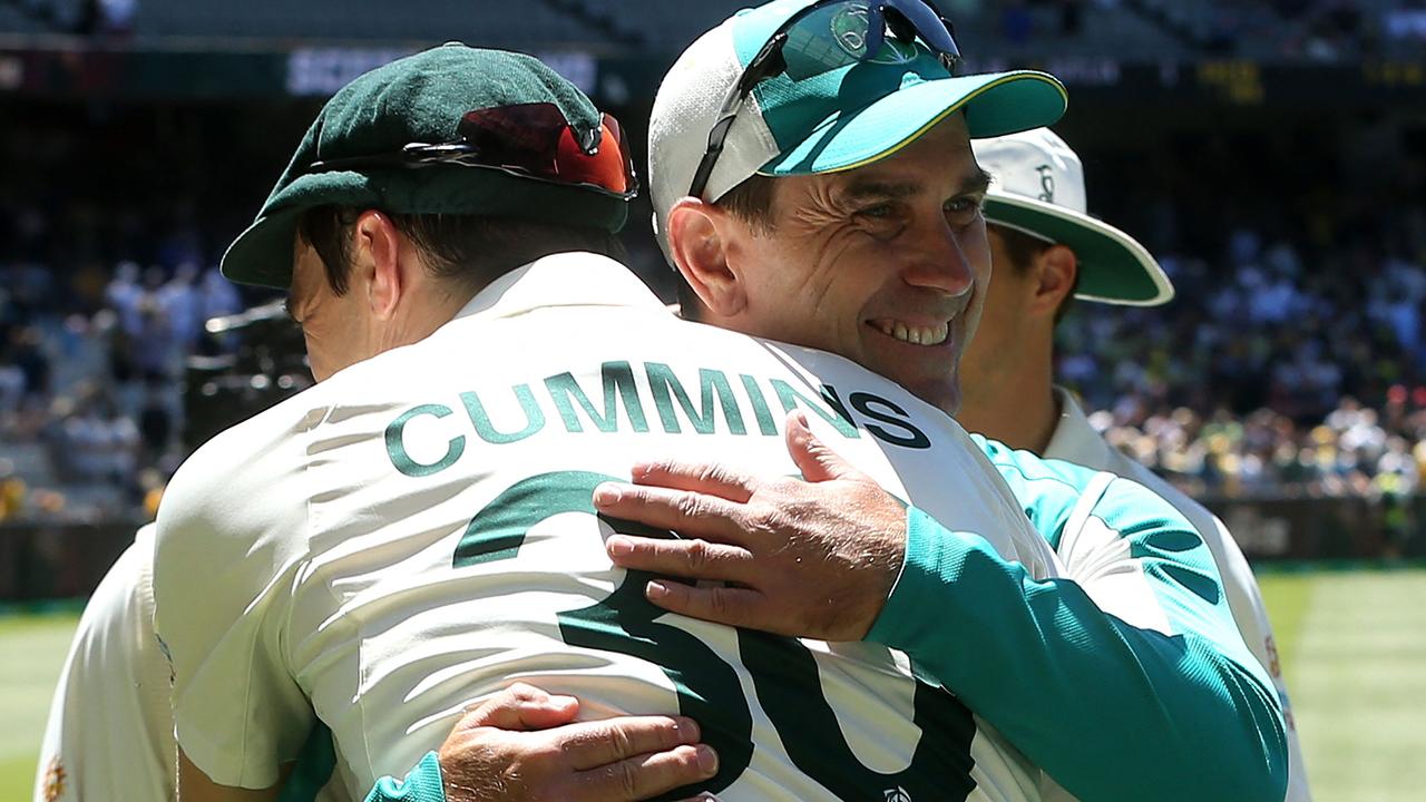 Australia's captain Pat Cummins gives a hug to Justin Langer after Australia retained the Ashes in Melbourne. Picture: AFP