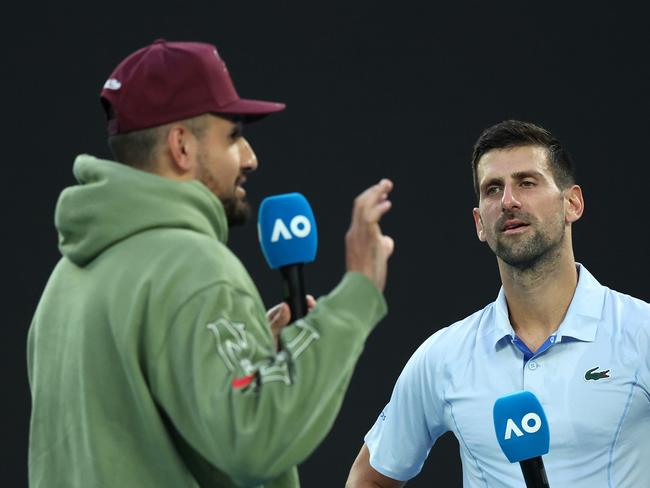 MELBOURNE, AUSTRALIA - JANUARY 23: Novak Djokovic of Serbia is interviewed by Nick Kyrgios after their quarterfinals singles match against Taylor Fritz of the United States during the 2024 Australian Open at Melbourne Park on January 23, 2024 in Melbourne, Australia. (Photo by Daniel Pockett/Getty Images)