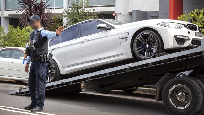 Operation Pegasus officers remove a car as part of an NDIS investigation. Picture: Australian Federal Police