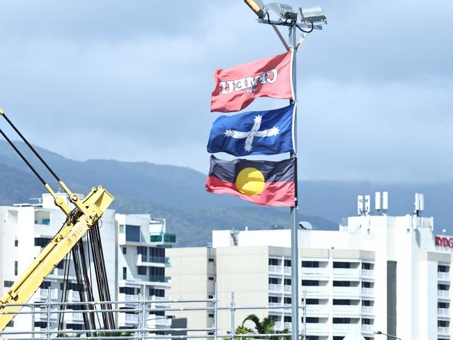 The Construction, Forestry and Maritime Employees Union (CFMEU) flag, the Eureka flag and the Aboriginal flag flies above the Cairns Tropical Enterprise Centre construction site, located on Sheridan Street near the Cairns Hospital. Picture: Brendan Radke.