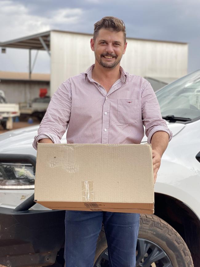 Northern Territory Cattlemen’s Association chief executive Will Evans delivers Covid tests.