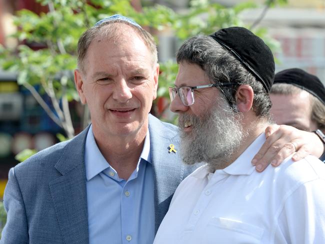 Yumi Friedman, who was inside the synagogue at the time of the fire, with Caulfield MP David Southwick. Picture: Andrew Henshaw