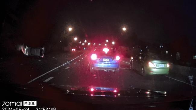 The hatchback comes to a stop on its side. Picture: Supplied / Dash Cam Owners Australia