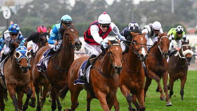 MELBOURNE, AUSTRALIA - JUNE 03: Thomas Stockdale riding King Magnus winning Race 8, the Vrc Community Plate,  during Melbourne Racing at Flemington Racecourse on June 03, 2023 in Melbourne, Australia. (Photo by Vince Caligiuri/Getty Images)