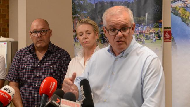 Lismore City Mayor Steve Krieg, National Recovery and Resilience Minister Bridget Mckenzie and Prime Minister Scott Morrison in Lismore City Council Chamber. Picture: Nicholas Rupolo