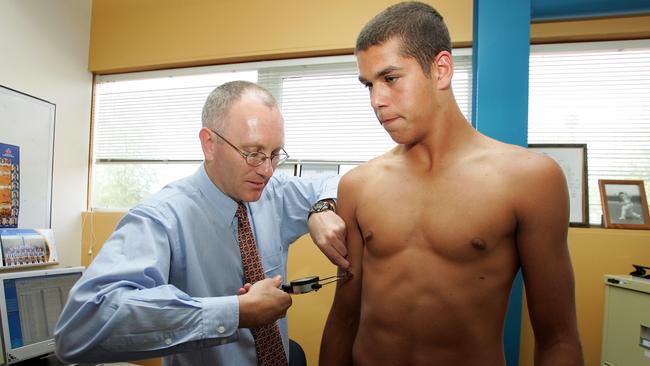 A young Lance Franklin getting his skinfolds tested ahead of the 2004 draft. Picture: Getty