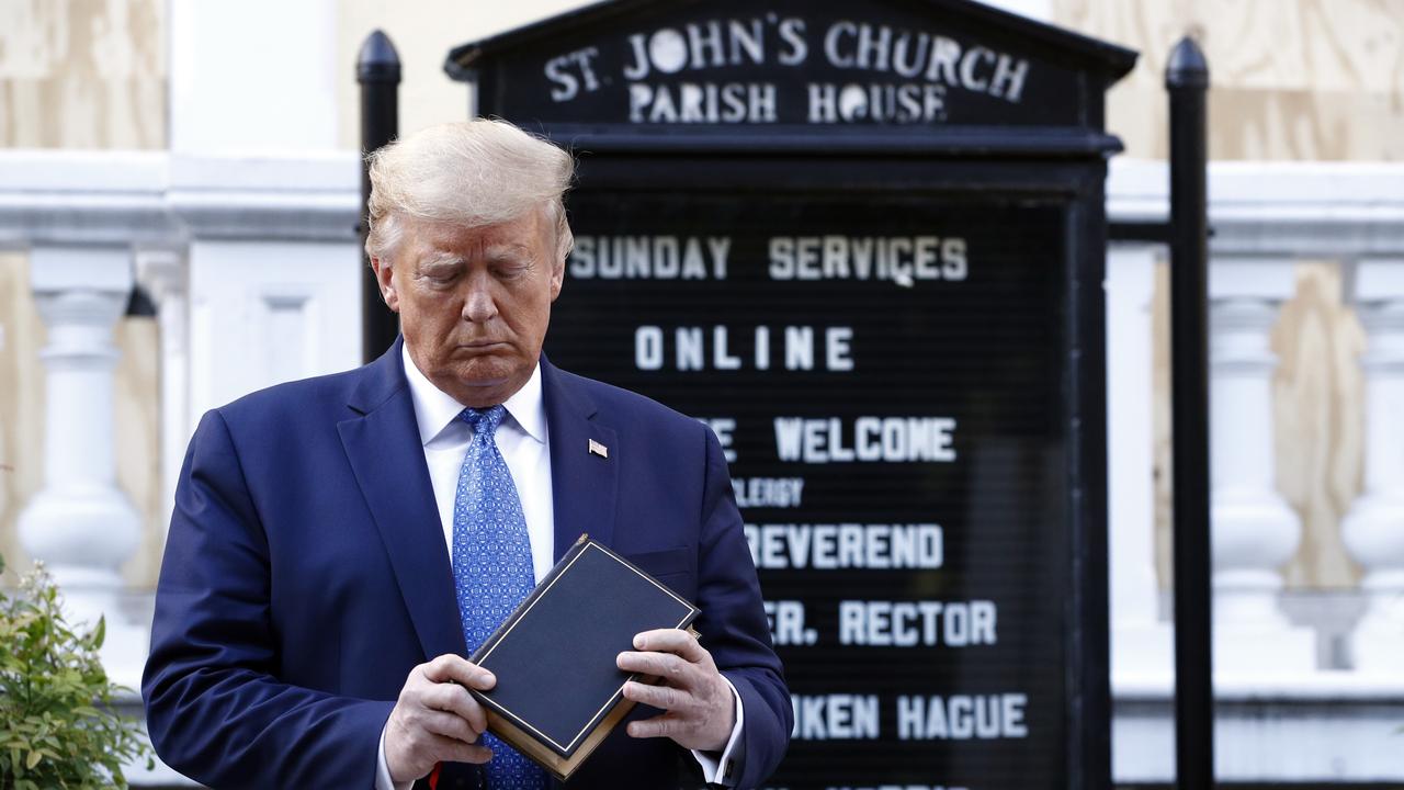 Trump holds a Bible as he visits St. John's Church across Lafayette Park from the White House. Picture: AP