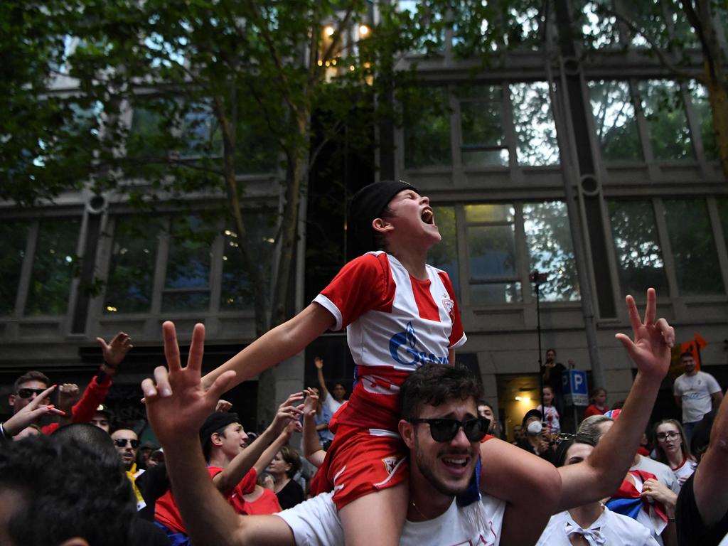 Members of the local Serbian community play music and dance in Melbourne on Monday. Picture: William West/AFP