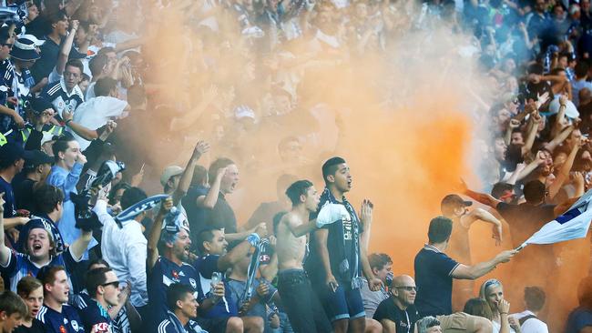 MELBOURNE, AUSTRALIA - FEBRUARY 13: A flare is ignited in the Melbourne Victory supporters area of the crowd during the round 19 A-League match between Melbourne City FC and Melbourne Victory at AAMI Park on February 13, 2016 in Melbourne, Australia. (Photo by Scott Barbour/Getty Images)