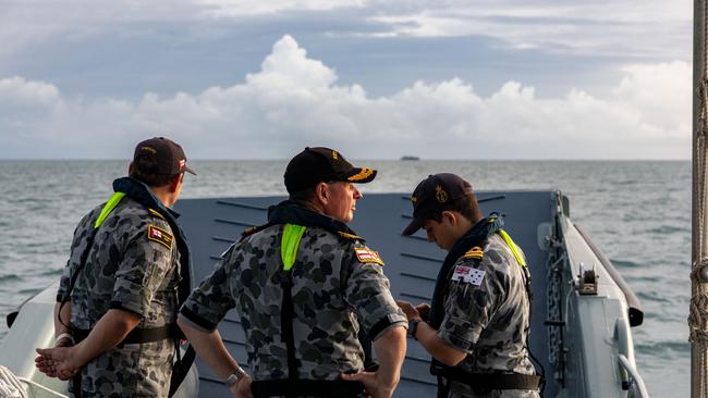 Hammond with Fleet Command Warrant Officer Andrew Bertoncin OAM RAN (centre), and Lieutenant Liam Whitfield depart HMAS Cairns enroute to rendezvous with Australian Defence Vessel Cape Inscription, Cairns.