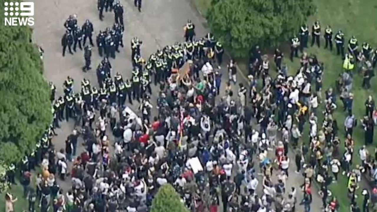 Police form a ring around protesters in Melbourne. Picture: Nine News