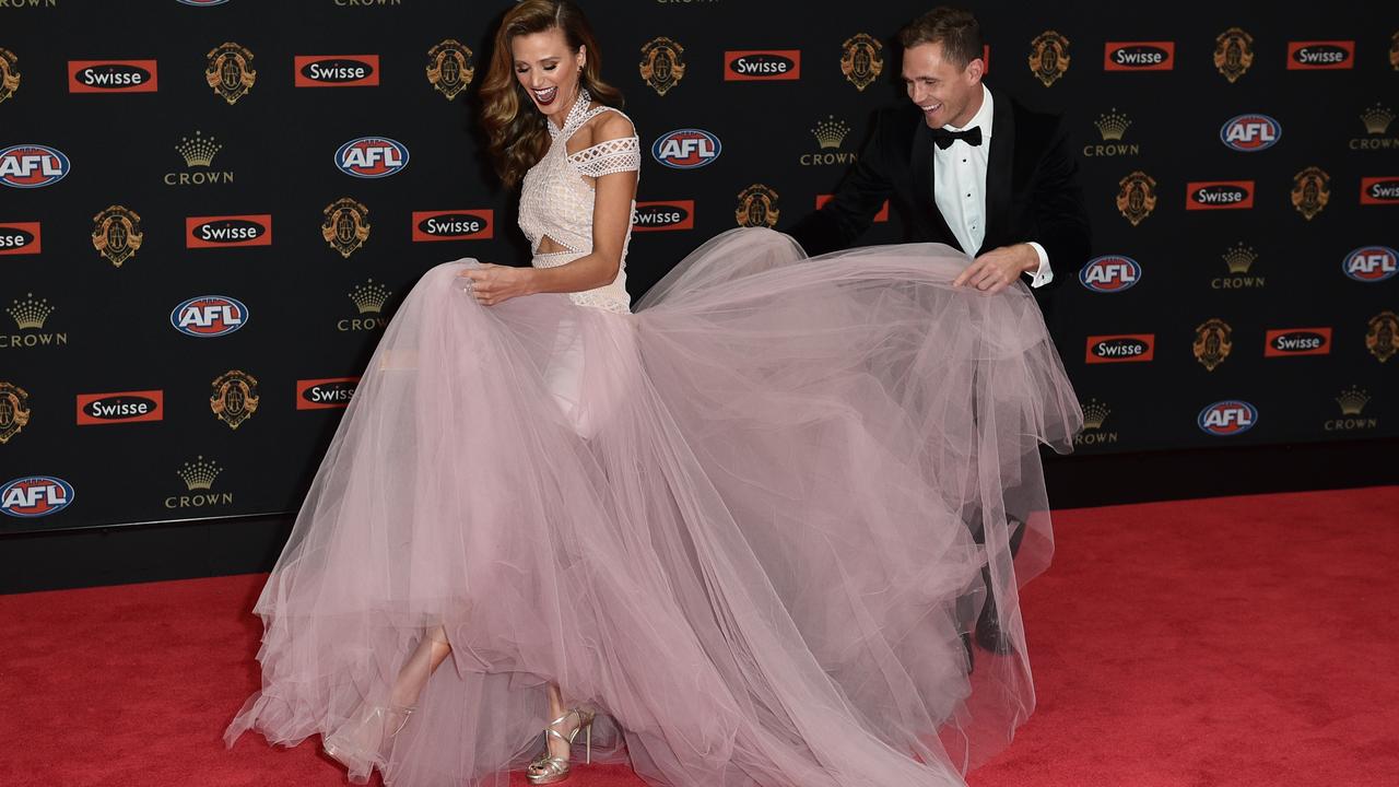 Brit Davis gets a hand from Geelong captain Joel Selwood.