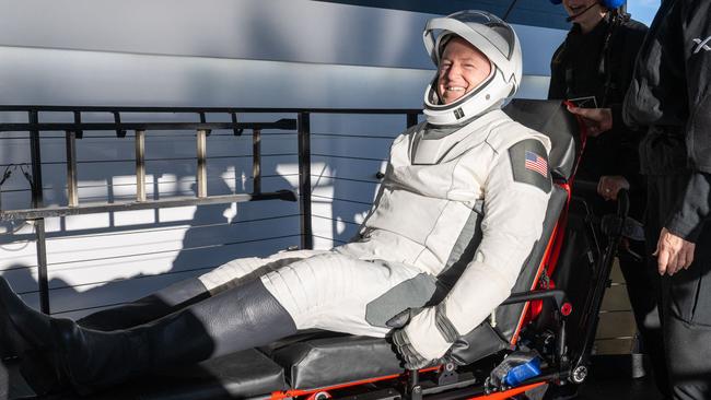 Butch Wilmore smiled after being helped out of the craft. Picture: Keegan Barber/NASA/AFP