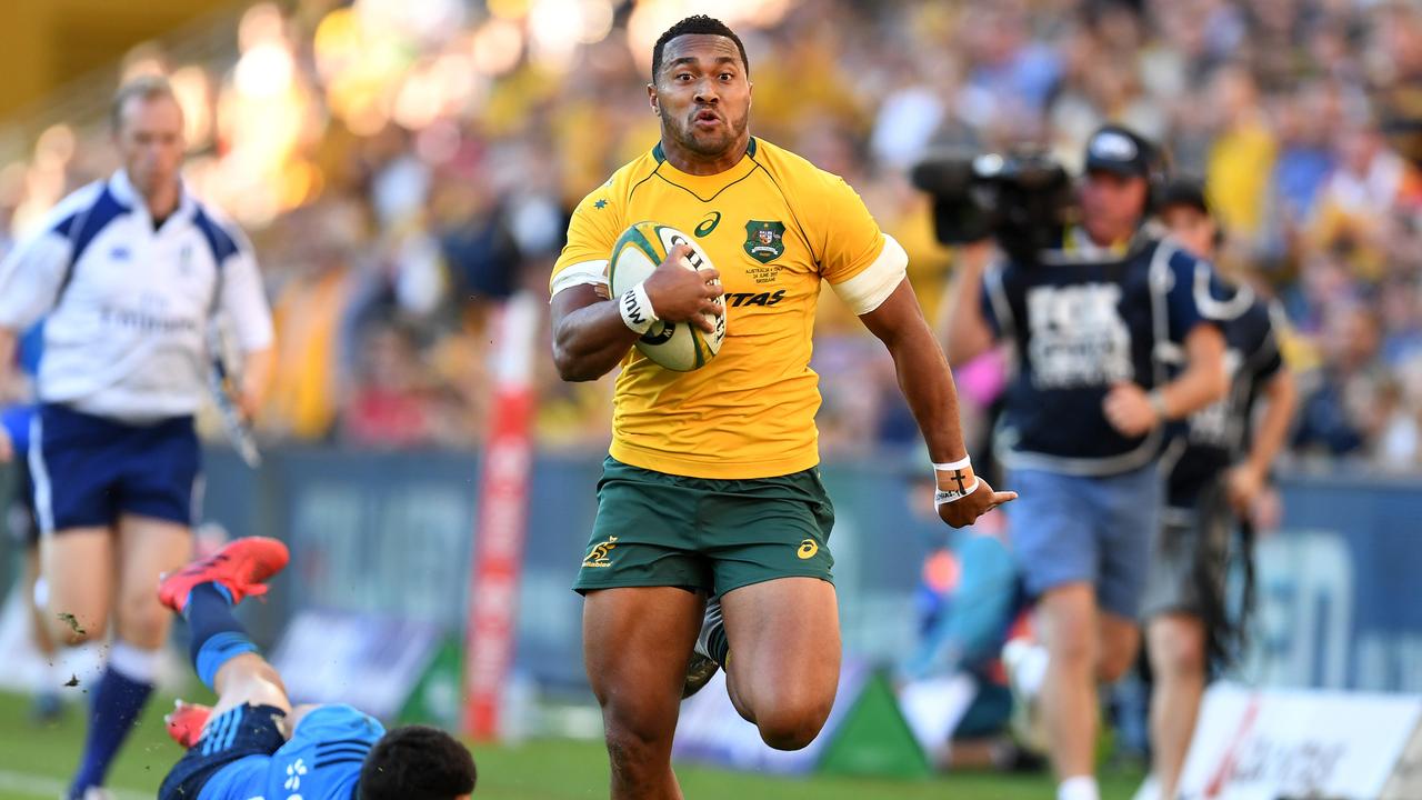 Sefa Naivalu of the Wallabies runs to score a try at Suncorp Stadium in Brisbane.
