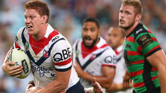 SYDNEY, AUSTRALIA - APRIL 08: Dylan Napa of the Roosters is tackled during the round six NRL match between the South Sydney Rabbitohs and the Sydney Roosters at ANZ Stadium on April 8, 2016 in Sydney, Australia. (Photo by Cameron Spencer/Getty Images)