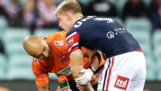 SYDNEY, AUSTRALIA - APRIL 10:  Freddy Lussick of the Roosters receives attention from the trainer during the round five NRL match between the Sydney Roosters and the Cronulla Sharks at Sydney Cricket Ground, on April 10, 2021, in Sydney, Australia. (Photo by Mark Kolbe/Getty Images)