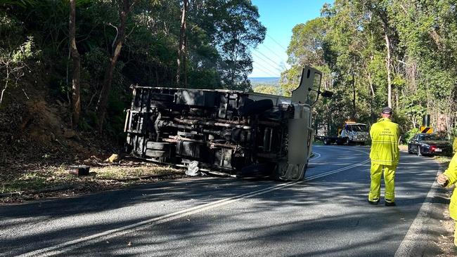 Police closed off Doonan Rd following a truck rollover, with one person taken to hospital with neck pain. Picture: Contributed