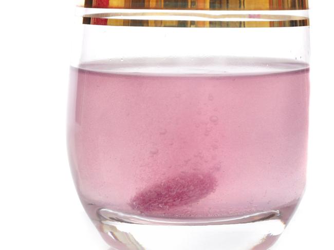 STOCK - Sydney, Australia - July 20, 2015:  Hydralyte effervescent tablet dissolving in a glass of water producing bubbles .  Shot in the studio on a white background, Picture: Istock