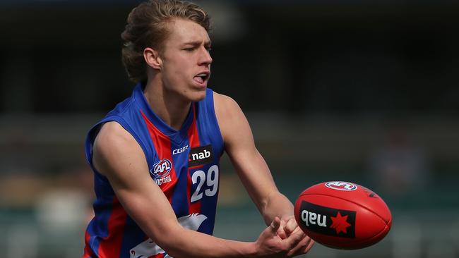 MELBOURNE, AUSTRALIA - SEPTEMBER 01: Finlay Macrae of the Chargers handballs during the NAB League 2nd Qualifying Final match between the Gippsland Power v Oakleigh Chargers at IKON Park on September 01, 2019 in Melbourne, Australia. (Photo by Mike Owen/AFL Photos via Getty Images)