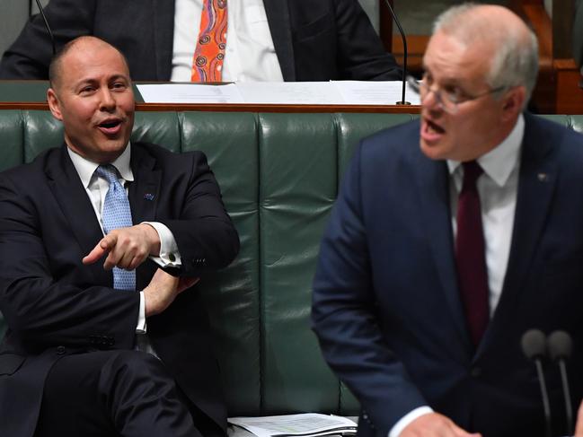 CANBERRA, AUSTRALIA - OCTOBER 07: Prime Minister Scott Morrison and Treasurer Josh Frydenberg during Question Time in the House of Representatives at Parliament House on October 07, 2020 in Canberra, Australia. The Morrison government's second budget was published on Tuesday, after its release in May was delayed by the COVID-19 pandemic. Treasurer Frydenberg has delivered a federal budget deficit of $213.7 billion in the wake of coronavirus and related shutdowns, with a number of tax cuts to be introduced to help boost the economy and create jobs as Australia experiences its first recession in 29 years.  (Photo by Sam Mooy/Getty Images)