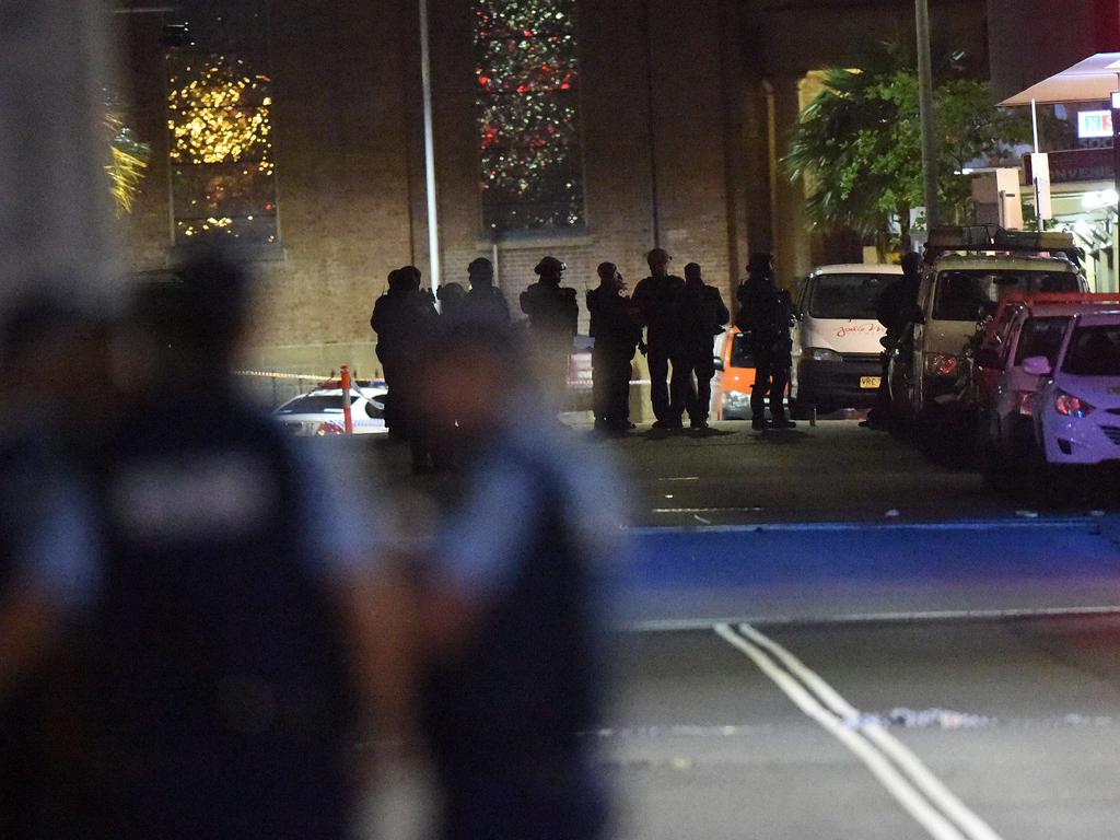 Armed police gather outside the Lindt cafe. Picture: Saeed Khan (AFP)