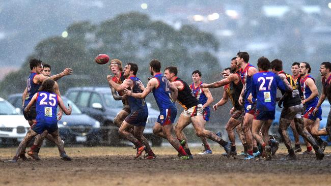 South Barwon and St Joseph’s clash in heavy rain in the Geelong Football League.