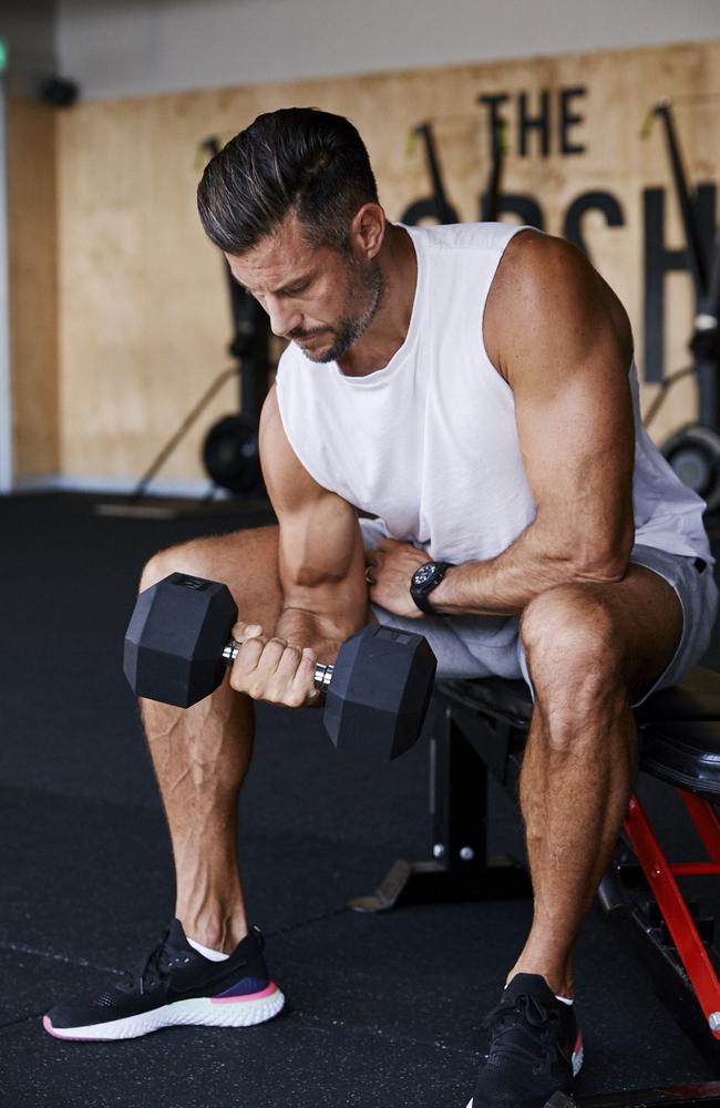 Sam Wood works on toning his arms.