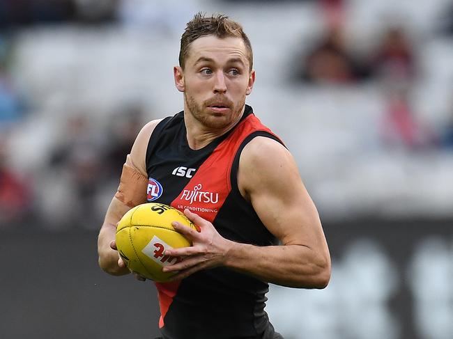 Devon Smith of the Bombers is seen in action during the Round 16 AFL match between the Essendon Bombers and the Collingwood Magpies at the MCG in Melbourne, Sunday, July 8, 2018. (AAP Image/Julian Smith) NO ARCHIVING, EDITORIAL USE ONLY