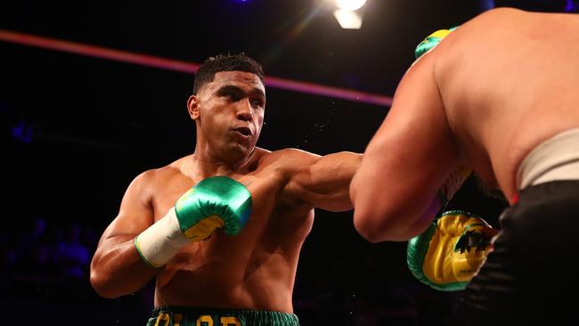 Tevita Pangai Jr punches Gerico Cecil during the Heavyweight bout at Fortitude Music Hall on December 04, 2021 in Brisbane, Australia. (Photo by Chris Hyde/Getty Images)