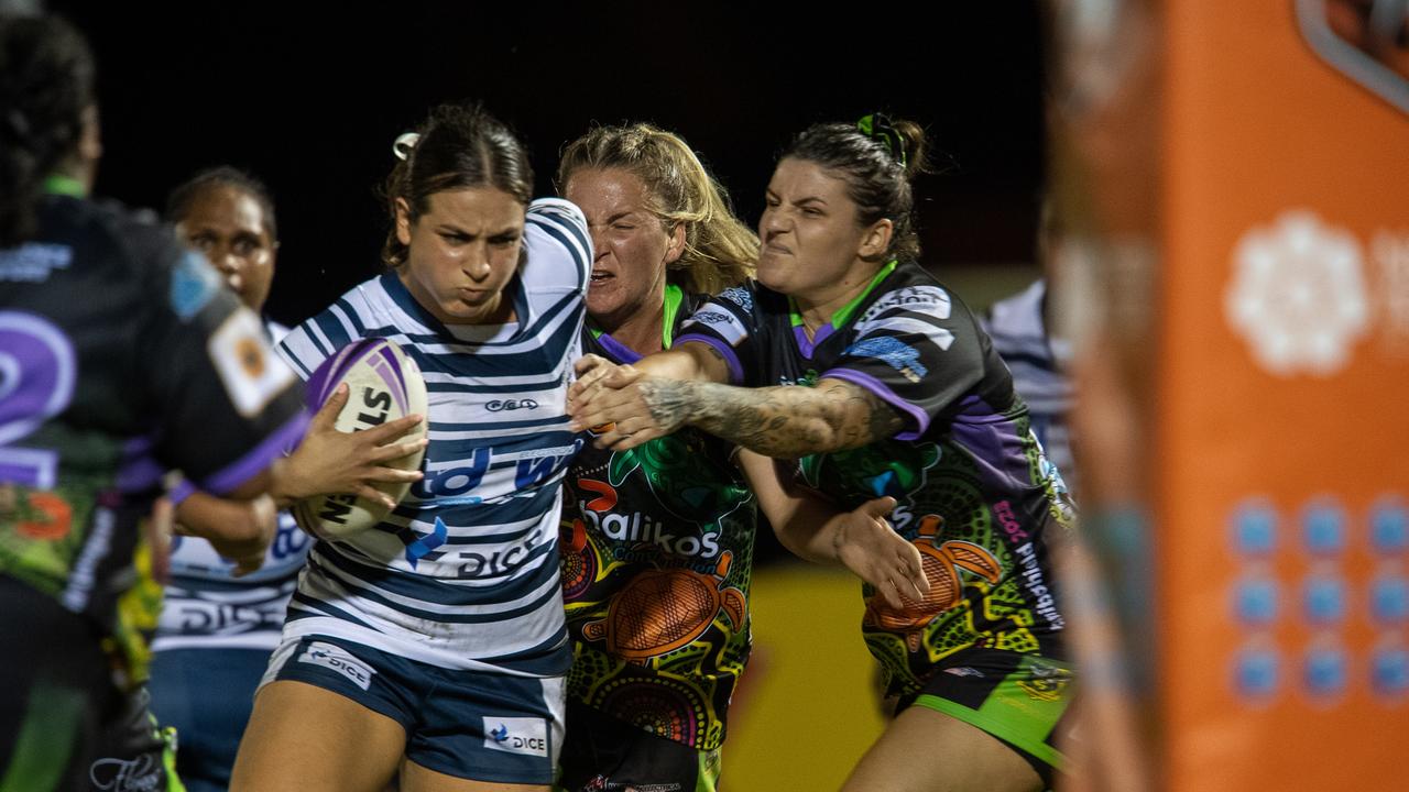 Ivana Schober fends off a tackle as the Darwin Brothers women take on the Palmerston Raiders in Round 12 of the 2023 NRL NT season. Picture: Pema Tamang Pakhrin