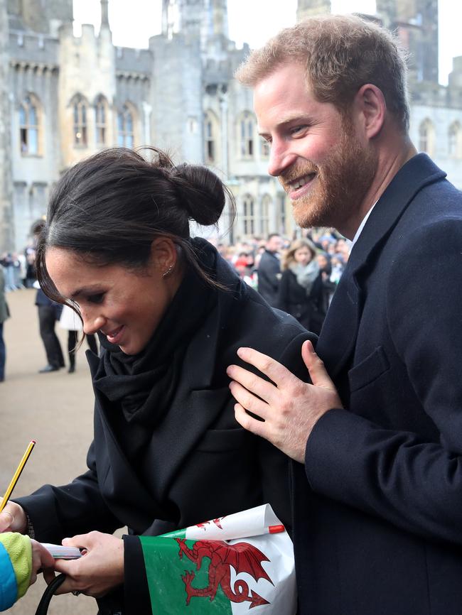 Prince Harry and his fiancee Meghan Markle are seen during a walkabout at Cardiff Castle on January 18, 2018 in Cardiff, Wales. Picture: Getty