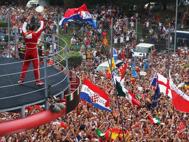 Fernando Alonso celebrates with Ferrari’s fans in 2013. Picture: Getty