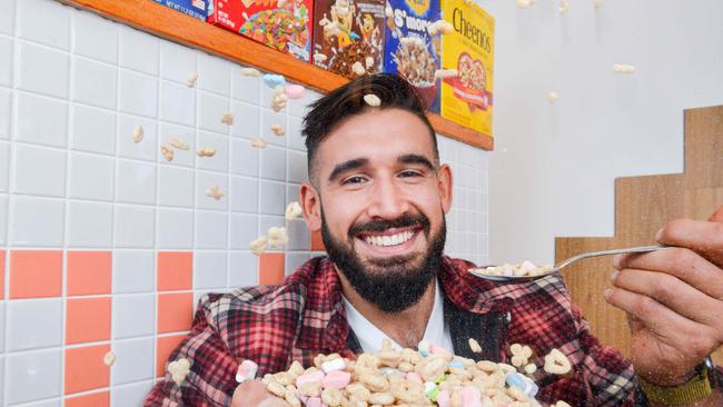 George Rhigas enjoying Lucky Charms cereal at Leeroy’s, SA's first cereal cafe in Morphett St. Picture: Brenton Edwards