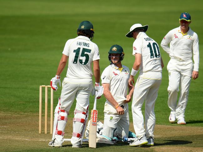 Cameron Bancroft on his knees after being hit in the groin. Picture: Harry Trump/Getty Images