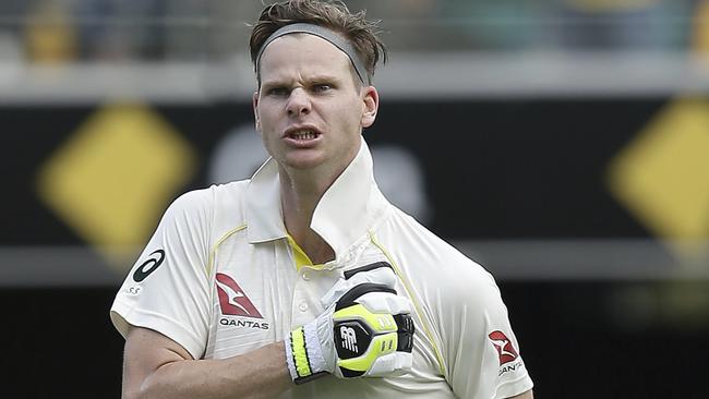 Steve Smith pounds his chest, urging his teammates to follow his lead after notching his 21st century.