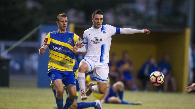 Gold Coast Premier League soccer, first v second, Broadbeach United v Surfers Paradise. Broadbeach's Timothy Kerwick and Surfers Paradise's Bruno Rodriguez. Picture: Jerad Williams