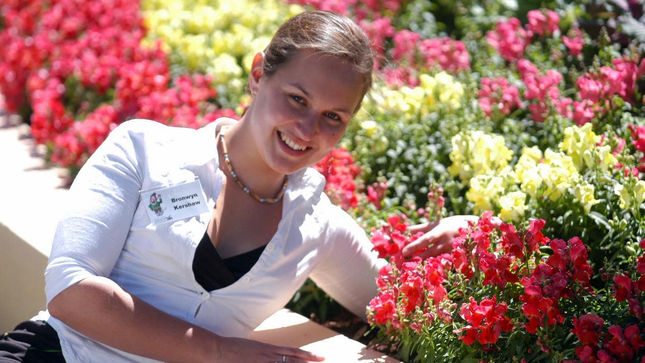 USQ student Bronwyn Kershaw, 21, enjoying the colours of the snapdragons at Picnic Point Toowoomba pic: David Martinelli