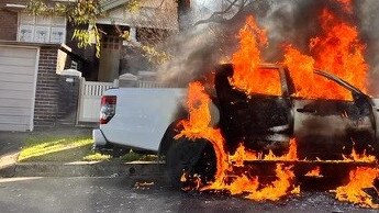 A car on fire after the Marrickville shooting on Marrickville rd. Image Twitter