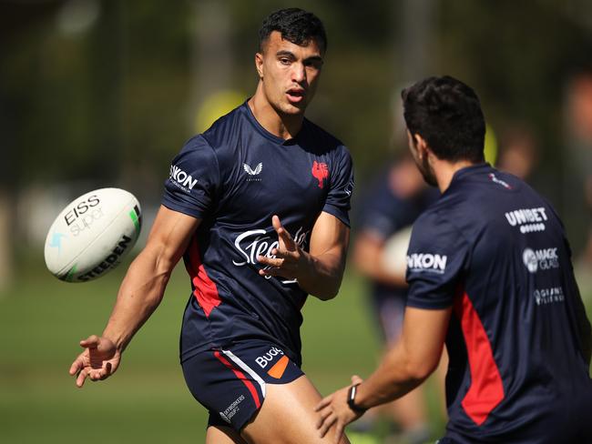 SYDNEY, AUSTRALIA - MARCH 29: Joseph Suaalii passes during a Sydney Roosters NRL training session at Kippax Lake on March 29, 2021 in Sydney, Australia. (Photo by Matt King/Getty Images)