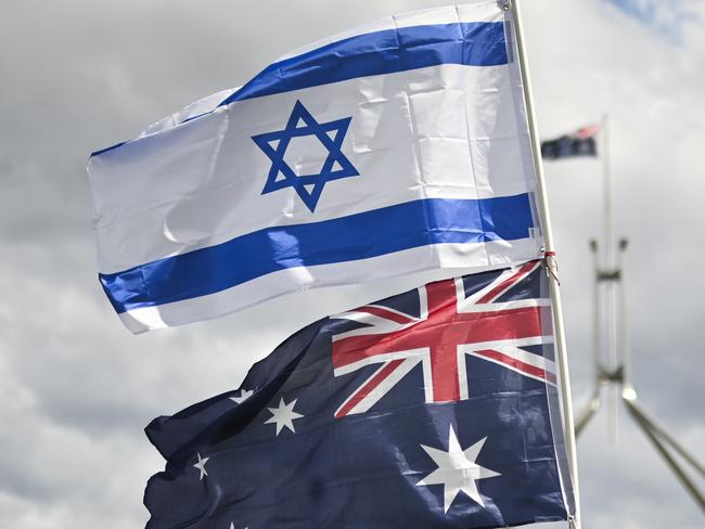 CANBERRA, Australia - NewsWire Photos - October 7, 2024: Thousands of attendees gather at Parliament House in Canberra taking an historic stand against antisemitism and to stand in support of Israel.  Picture: NewsWire / Martin Ollman