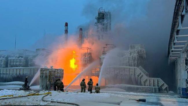 Rescuers work to extinguish a fire at a natural gas terminal in the Russian Baltic Sea port of Ust-Luga. Picture: AFP