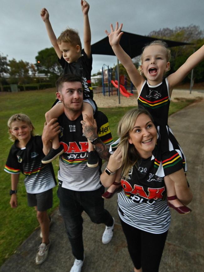 Panthers supporters Jordan Kelly and Amie White with Max, 3, Theo, 4, and Sadie, 3, near their home in Brisbane on Thursday. Picture: Lyndon Mechielsen