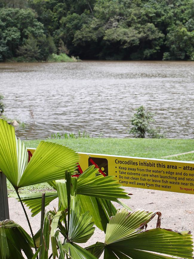 Queensland Department of Environment and Heritage Protection officers set a crocodile trap at Lake Placid, on the Barron River at Caravonica, after a man was bitten on the head by a crocodile while swimming. Picture: Brendan Radke