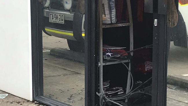 Rebels flags can be seen folded up inside the tattoo parlour in Brendale.