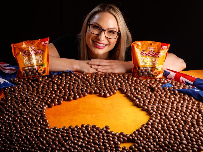 TAKING OVER: Polly Love with a giant map of FruChocs — the South Australian favourites are now available across the country. Picture: Matt Turner