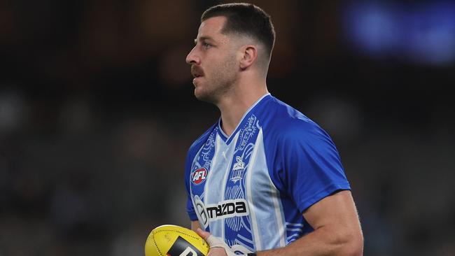 MELBOURNE, AUSTRALIA - APRIL 18: Tristan Xerri of the Kangaroos warms up ahead of the round six AFL match between North Melbourne Kangaroos and Carlton Blues at Marvel Stadium, on April 18, 2025, in Melbourne, Australia. (Photo by Daniel Pockett/Getty Images)