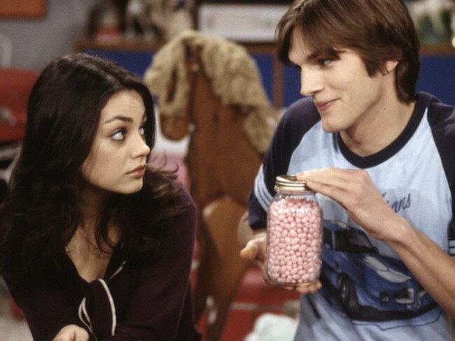 Mila Kunis and Ashton Kutcher in a scene from That ‘70s Show.