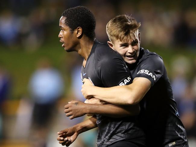 SYDNEY, AUSTRALIA - MARCH 17: Shayon Harrison of Melbourne City celebrates with his team mate Connor Metcalfe of Melbourne City after scoring his second goal during the round 22 A-League match between Sydney FC and Melbourne City at Leichhardt Oval on March 17, 2019 in Sydney, Australia. (Photo by Mark Kolbe/Getty Images)