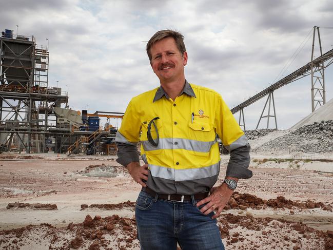 16/112018Pilbara managing director Ken Brinsden standing in front of a concentrator and Spodumene ore stockpile. Official opening of the Pilgangoora lithium mine near Port Hedland in Western Australia. pic Colin Murty The Australian